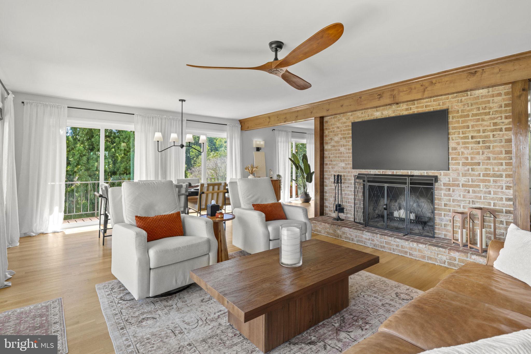 6970 Kim Lane Friendship, MD 20758 - Photo 20 of 50 a living room with furniture and a fireplace