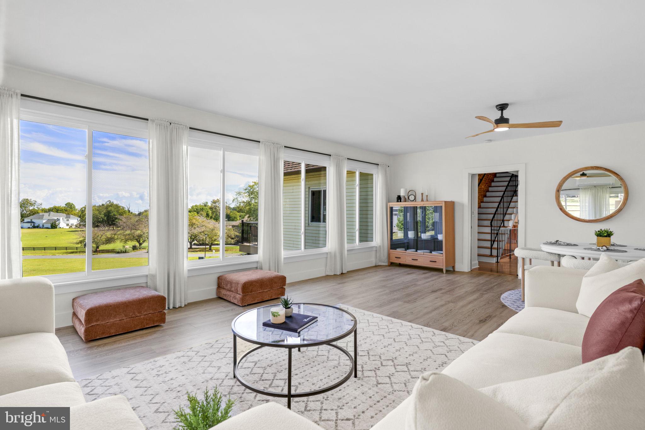6970 Kim Lane Friendship, MD 20758 - Photo 22 of 50 a living room with furniture and a large window