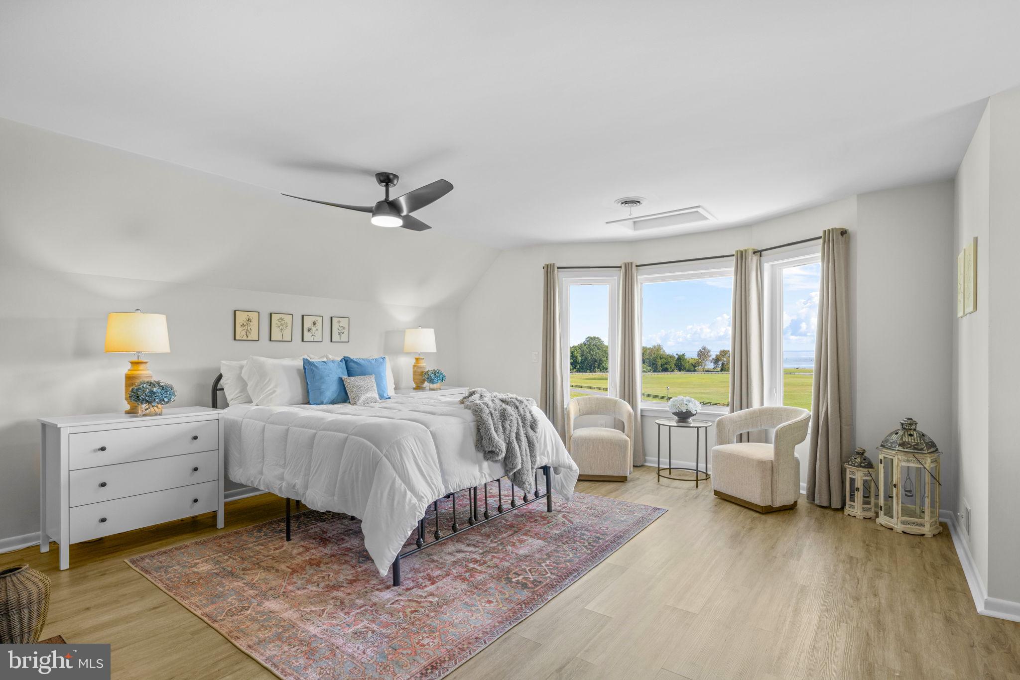 6970 Kim Lane Friendship, MD 20758 - Photo 25 of 50 a spacious bedroom with a bed and a couch