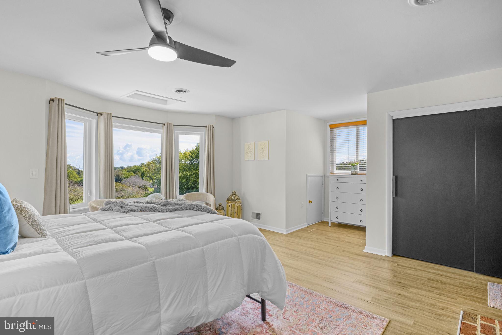 6970 Kim Lane Friendship, MD 20758 - Photo 27 of 50 a bedroom with a large bed and a window