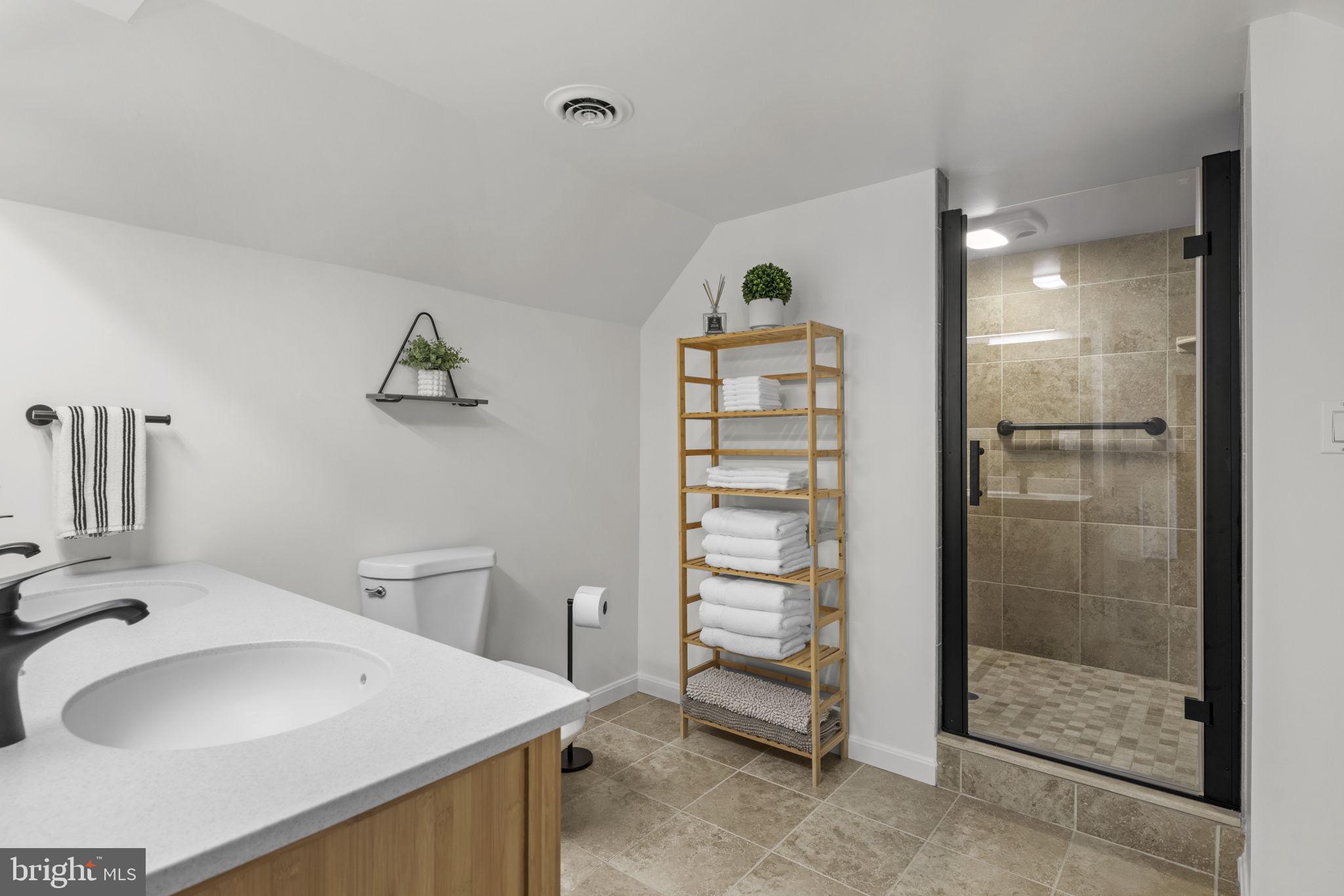 6970 Kim Lane Friendship, MD 20758 - Photo 31 of 50 a bathroom with a sink a toilet and shower