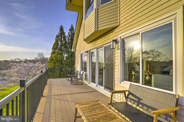 a balcony view with a seating space