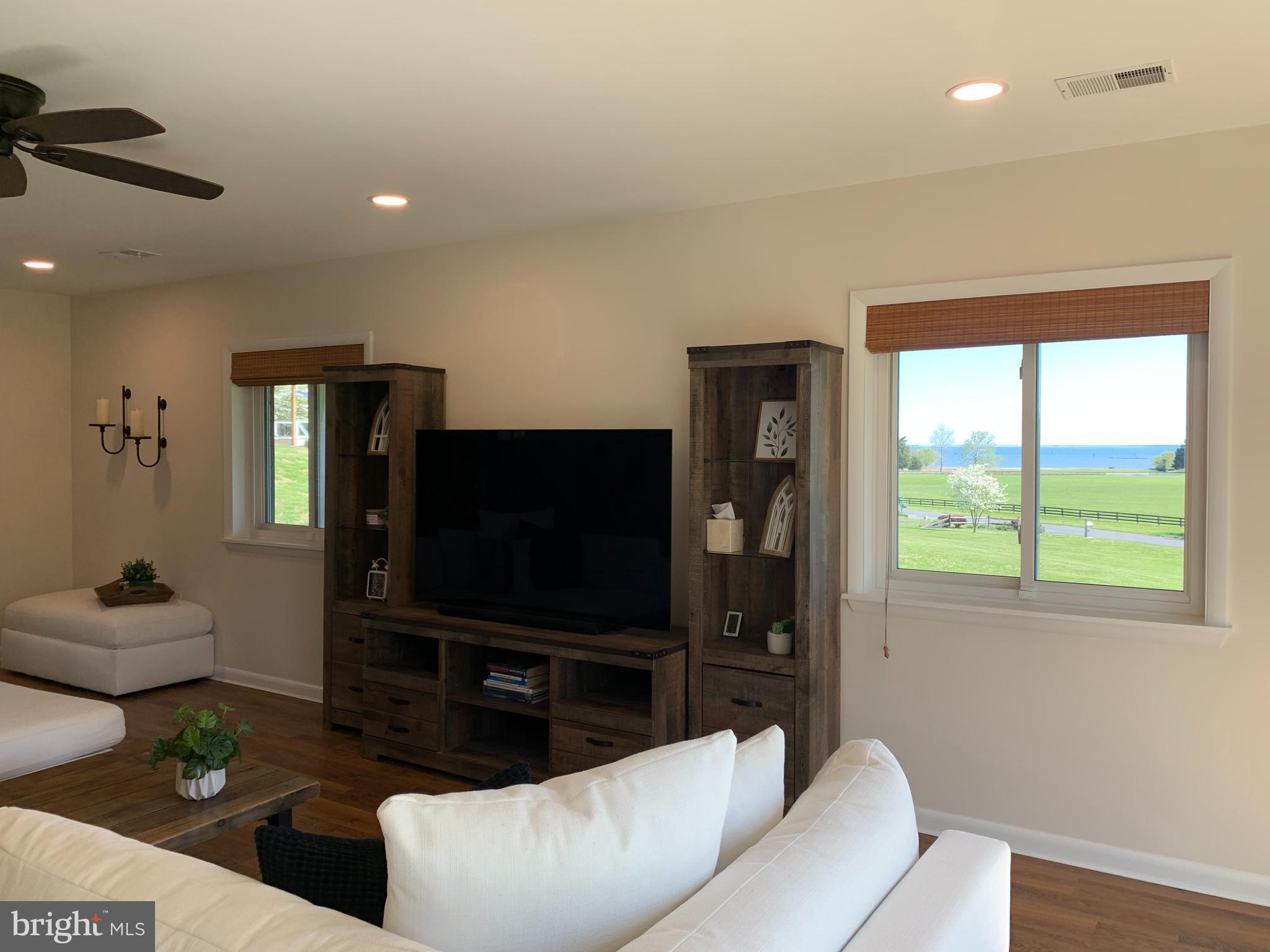 6970 Kim Lane Friendship, MD 20758 - Photo 37 of 50 a living room with furniture and a flat screen tv