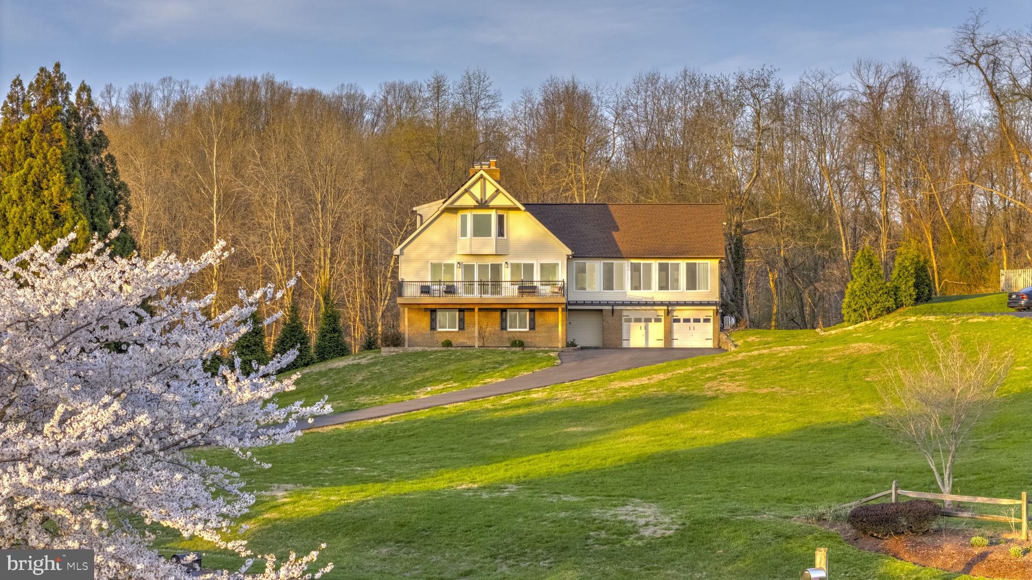 6970 Kim Lane Friendship, MD 20758 - Photo 40 of 50 a view of a big house with a big yard and large trees