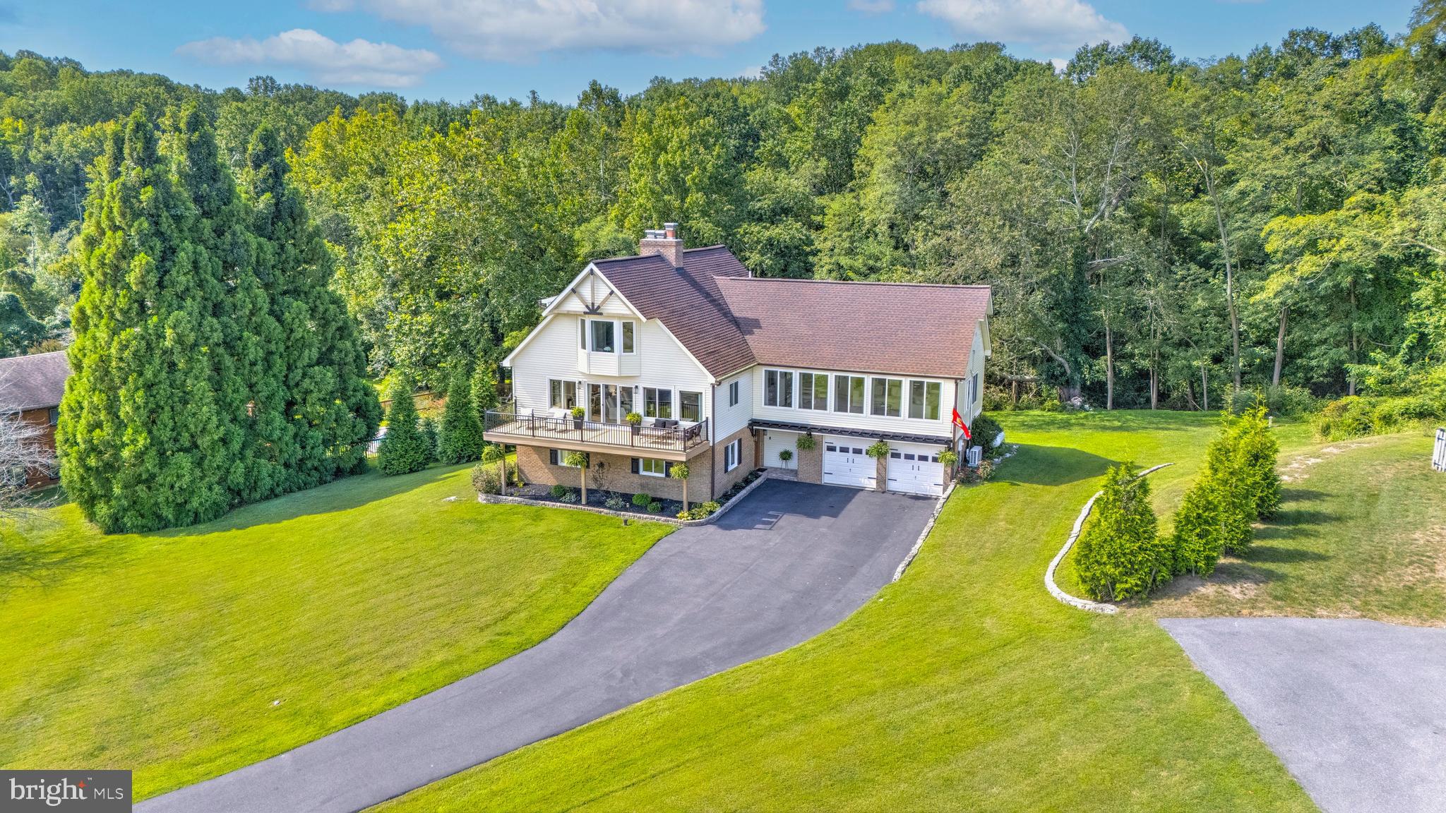 6970 Kim Lane Friendship, MD 20758 - Photo 45 of 50 a view of a house with swimming pool and deck