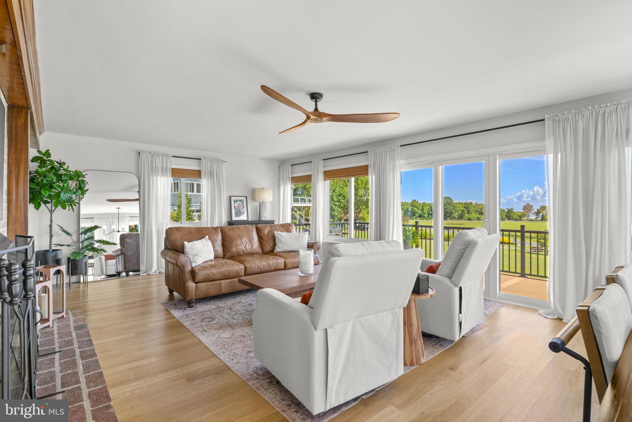6970 Kim Lane Friendship, MD 20758 - Photo 8 of 50 a living room with furniture and large windows