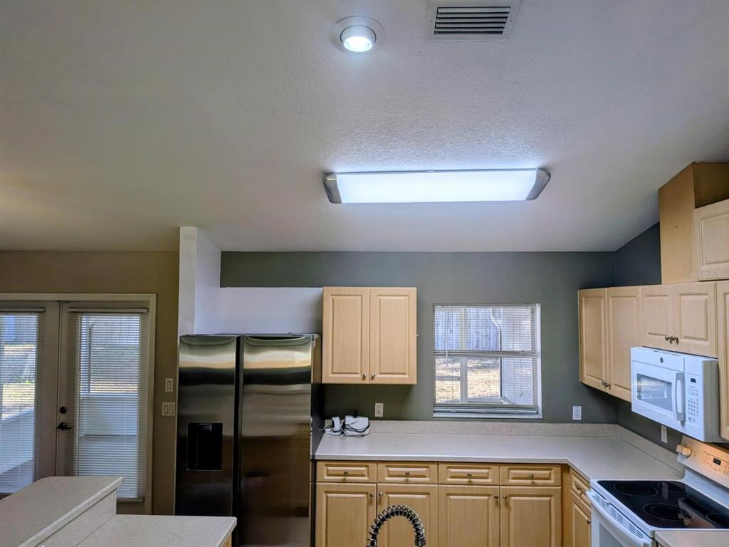 3764 East Sanders Street Inverness, FL 34453 - Photo 19 of 39 a view of a kitchen cabinets a sink and a window