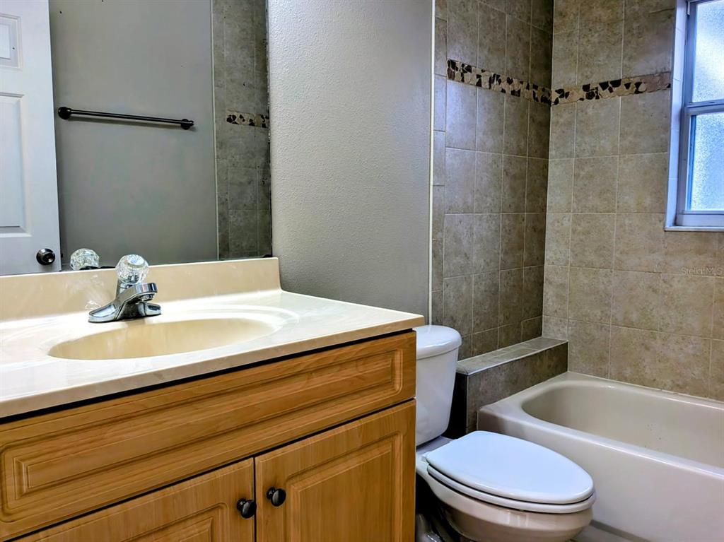 3764 East Sanders Street Inverness, FL 34453 - Photo 26 of 39 a bathroom with a sink a toilet and shower