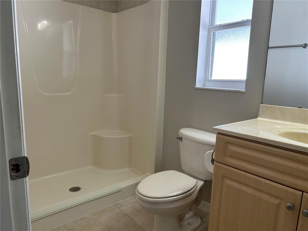 3764 East Sanders Street Inverness, FL 34453 - Photo 27 of 39 a bathroom with a sink a toilet and shower