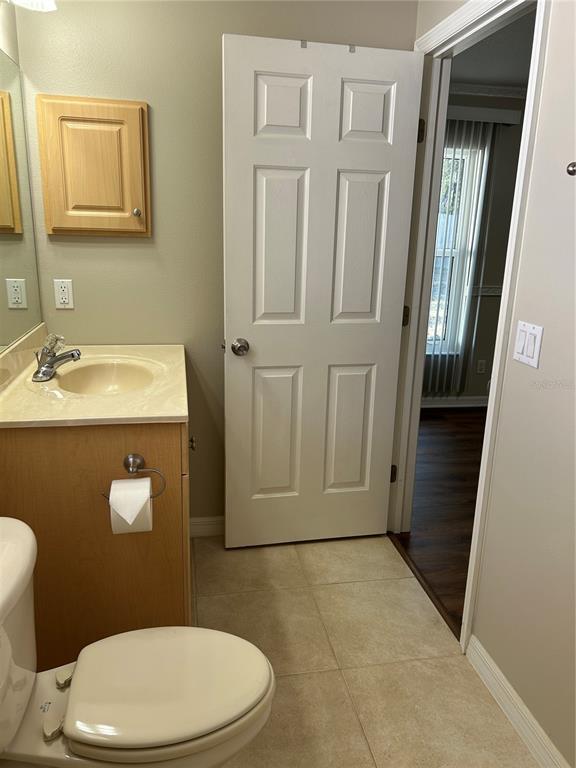 3764 East Sanders Street Inverness, FL 34453 - Photo 28 of 39 a bathroom with a sink a toilet and mirror