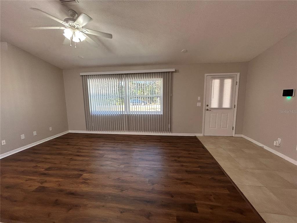 3764 East Sanders Street Inverness, FL 34453 - Photo 7 of 39 a view of empty room with wooden floor and fan