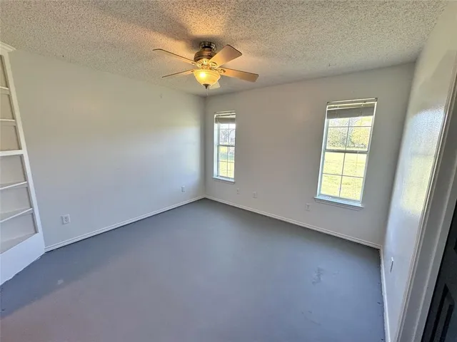 a living room with furniture a window and a chandelier