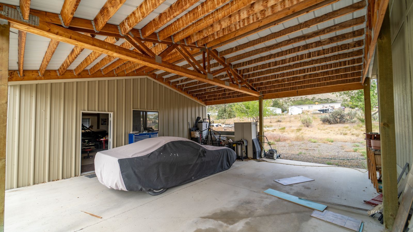 659 Spring Valley Lane Spring Creek, NV 89815 - Photo 24 of 25 a bed room with a bed and a large window