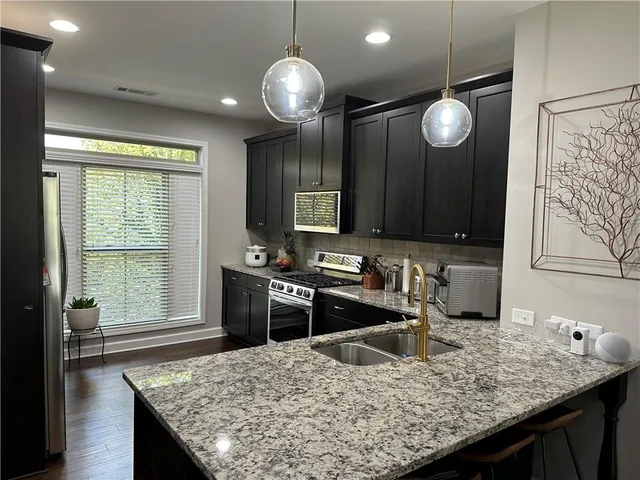 a kitchen with a stove and a wooden table top oven