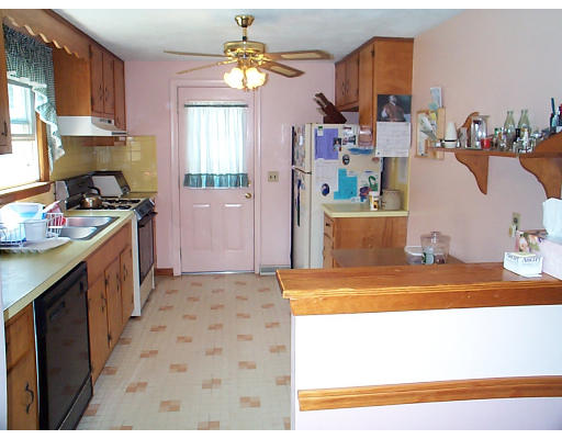 8 Patricia Road Billerica, MA 01821 - Photo 2 of 8 a kitchen with sink cabinets and appliances