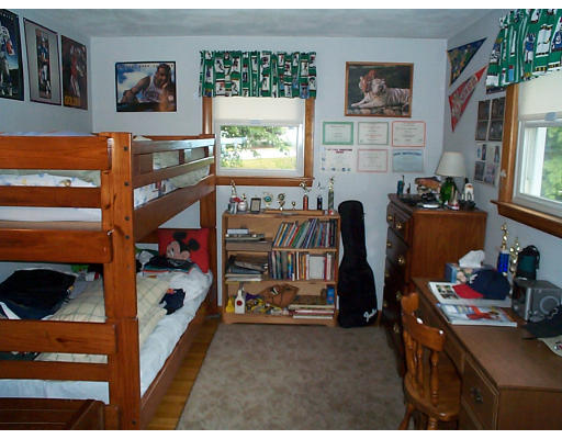 8 Patricia Road Billerica, MA 01821 - Photo 6 of 8 a bedroom with a bed and a window
