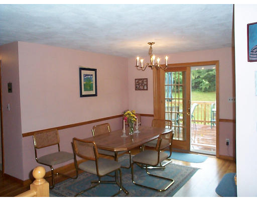 8 Patricia Road Billerica, MA 01821 - Photo 8 of 8 a view of a dining room with furniture a chandelier and wooden floor