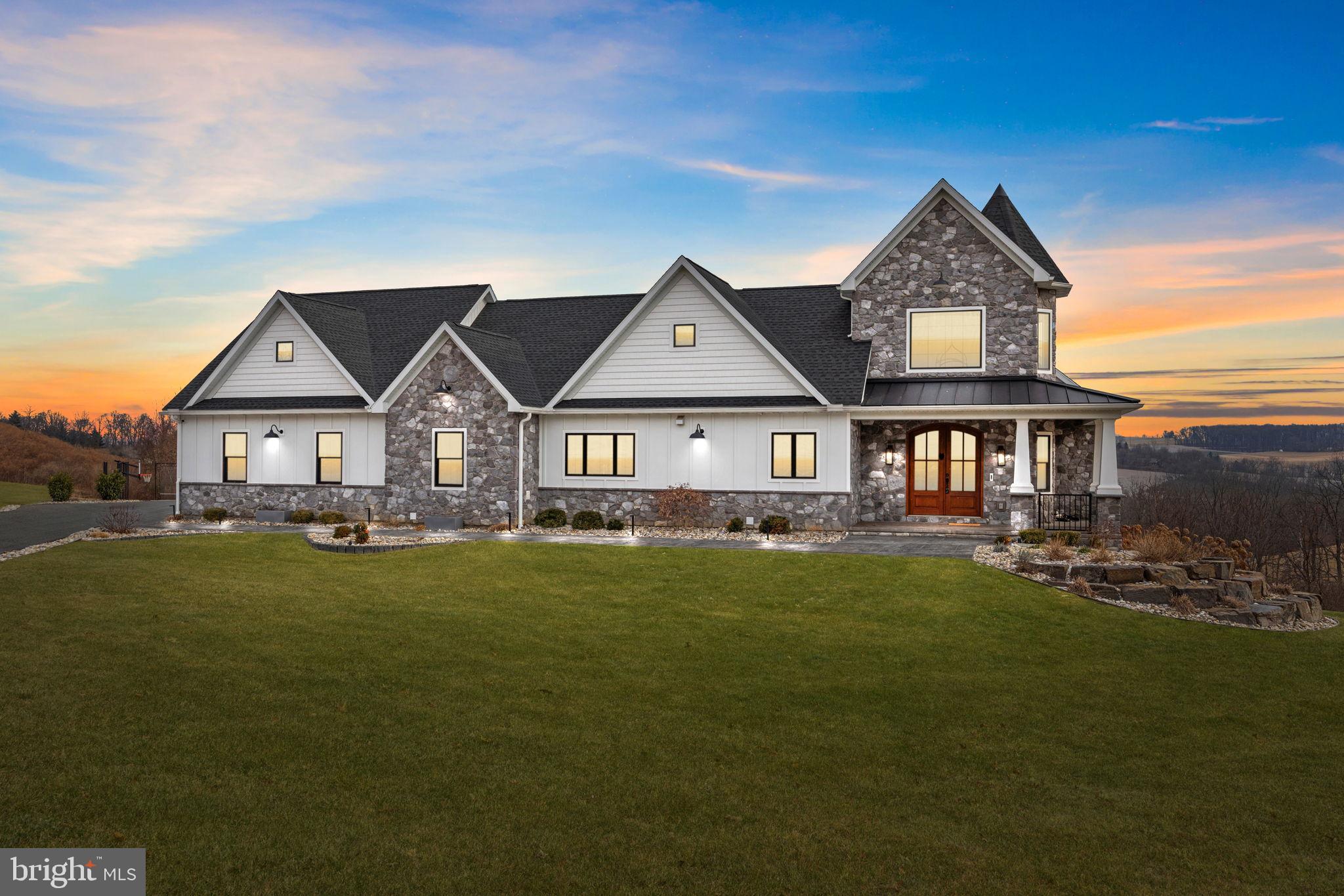 Stunning home with scenic sunset backdrop.