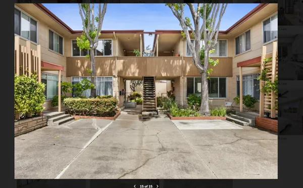 a view of a building with a yard