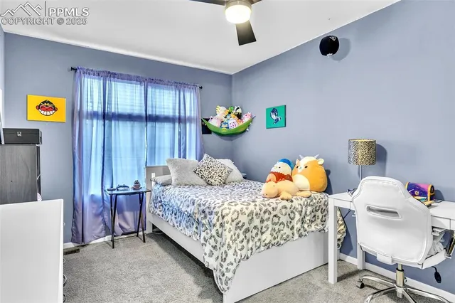 a bedroom with a bed and a furniture