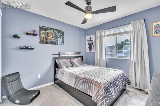 a bedroom with a bed and a chair