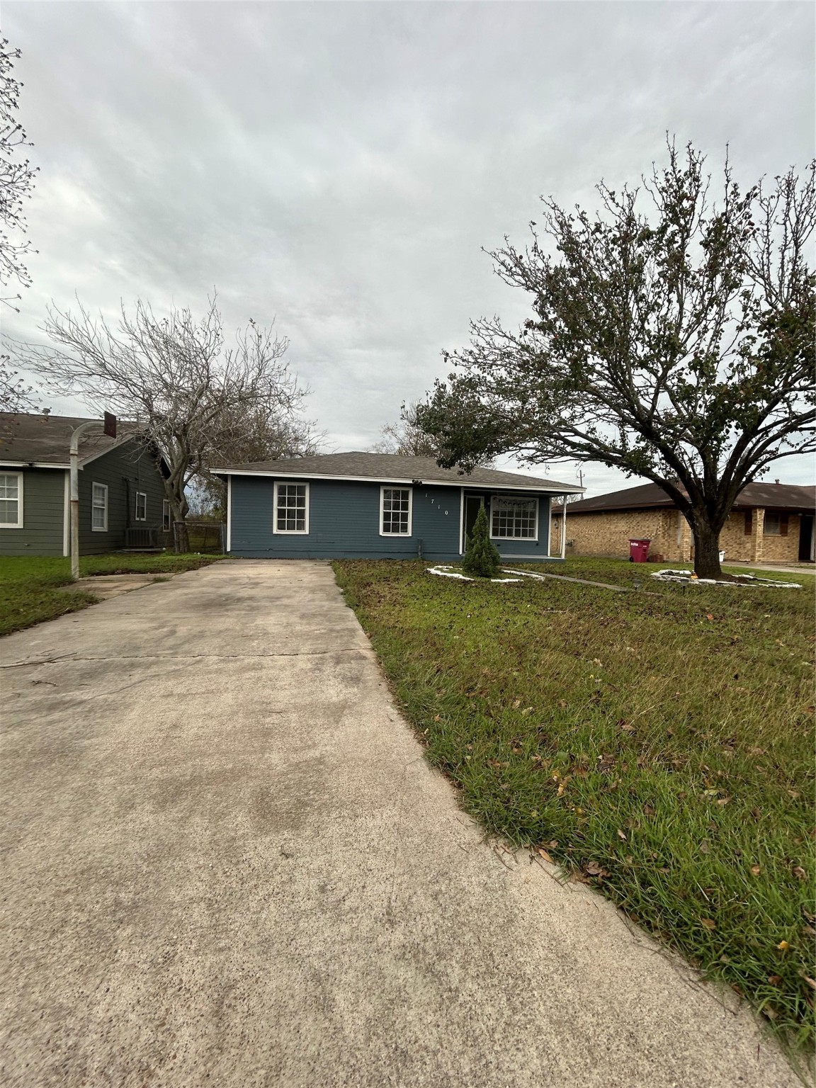 1710 North Avenue H Freeport, TX 77541 - Photo 1 of 17 front view of a house with a yard