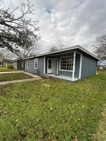 a house with trees in the background