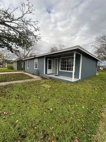 a house with trees in the background