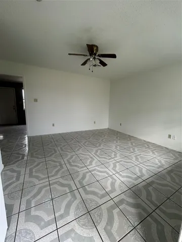 an empty room with white walls