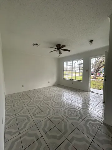 a view of an empty room and window
