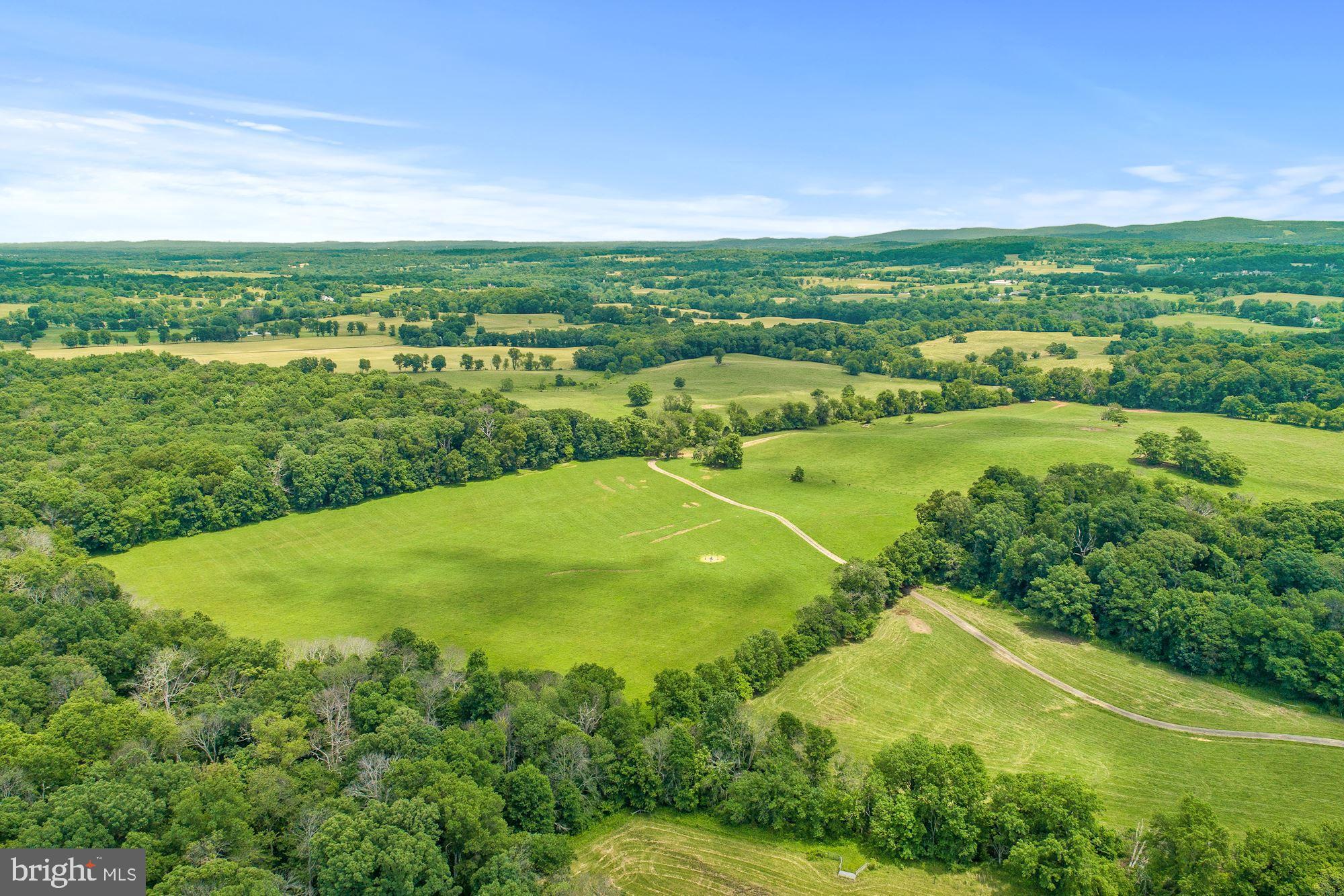 8160 Frogtown Road Marshall, VA 20115 - Photo 2 of 34 an aerial view of residential houses with outdoor space and trees