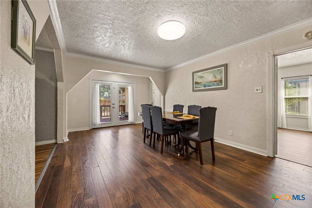 1415 South 9th Street Temple, TX 76504 - Photo 5 of 14 a view of a dining room with furniture and wooden floor