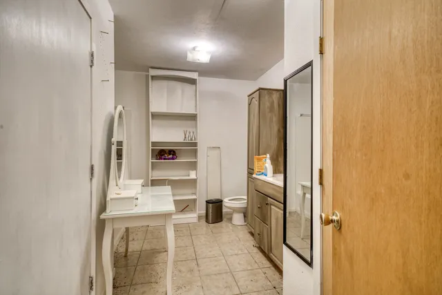 a bathroom with a glass shower door and a sink