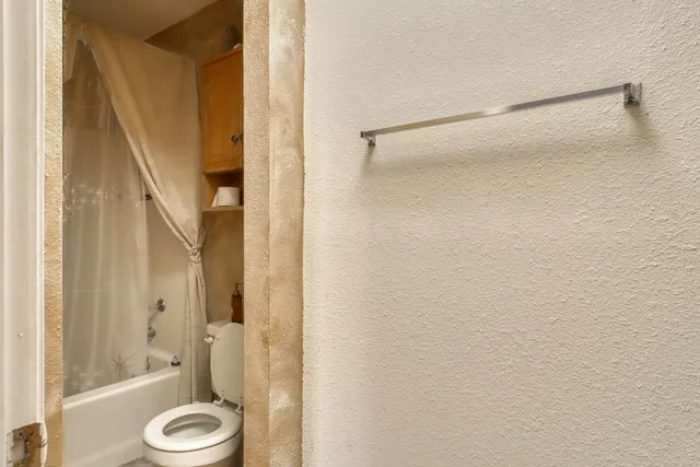 a bathroom with a tub and a shower