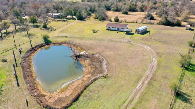 a view of a swimming pool with a yard