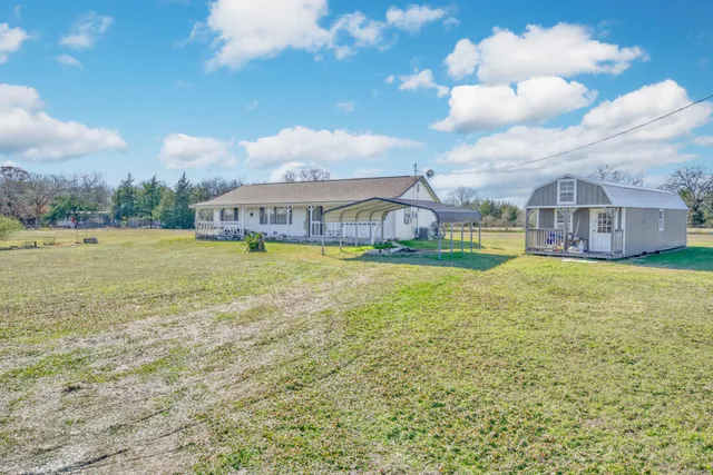 a view of a lake with a building in the background