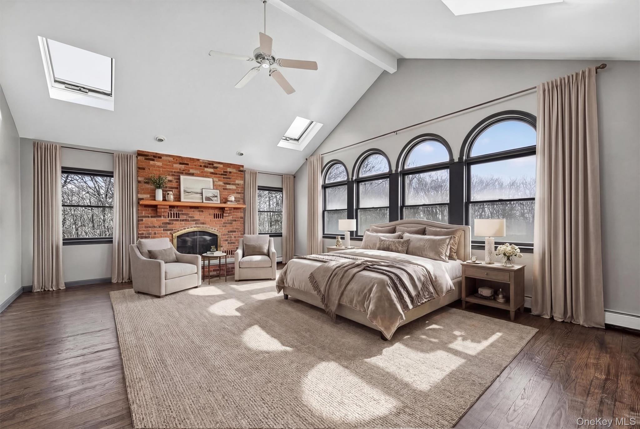285 Hill Road Goshen, NY 10924 - Photo 23 of 49 Spacious primary bedroom with Palladian windows, skylights and a brick fireplaceVirtually Staged