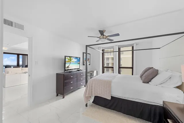 a bathroom with a double vanity sink mirror and bathtub