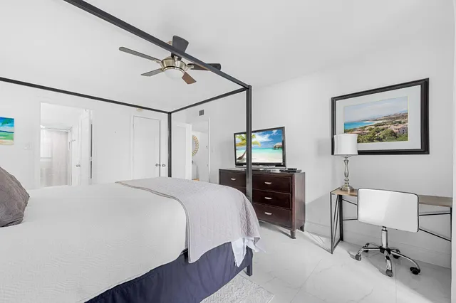 a bathroom with a bathtub a mirror and a shower