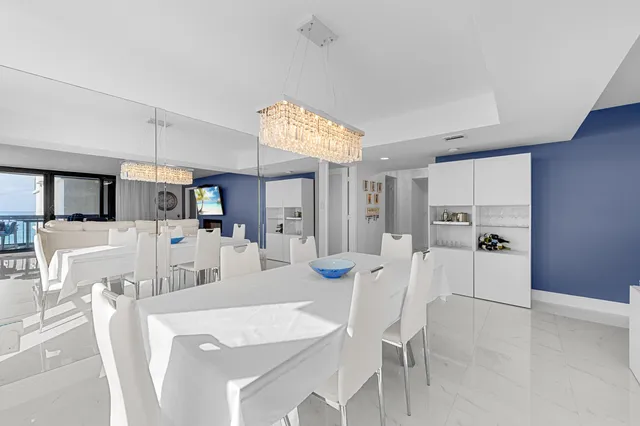 a living room with furniture and a book shelf