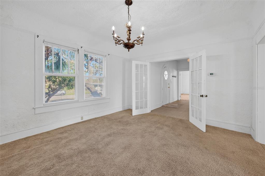 1616 Cres Ridge Road Daytona Beach, FL 32118 - Photo 12 of 40 a view of a chandelier in big room and chandelier fan