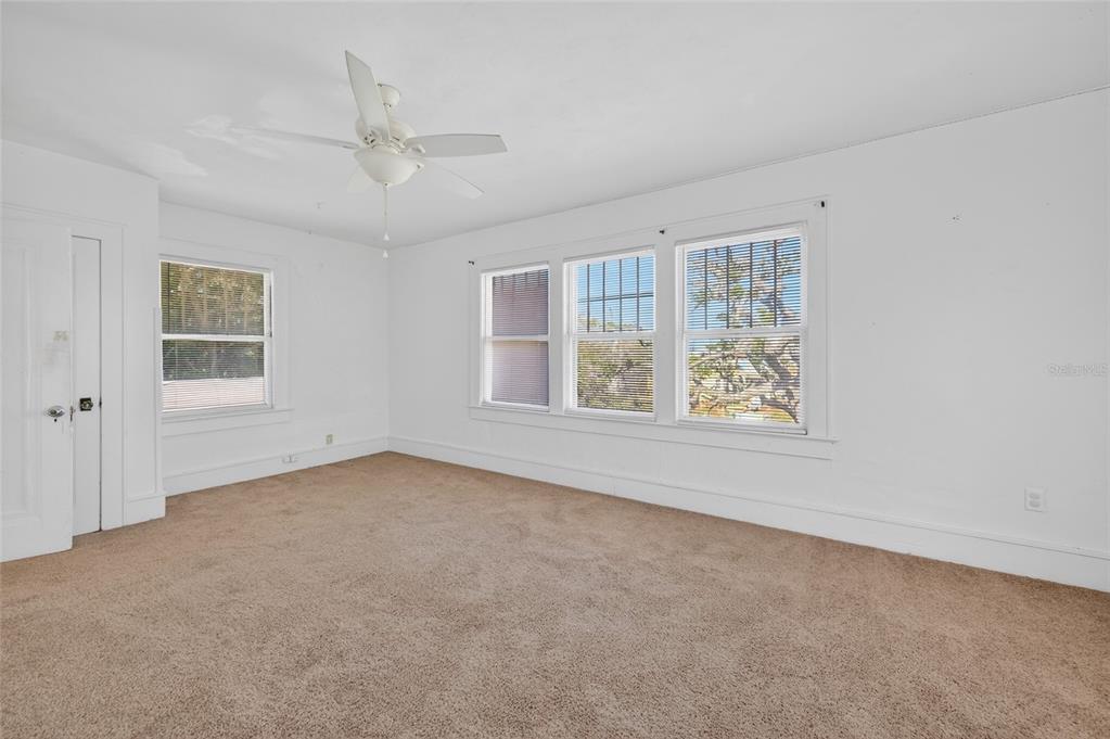 1616 Cres Ridge Road Daytona Beach, FL 32118 - Photo 19 of 40 an empty room with windows