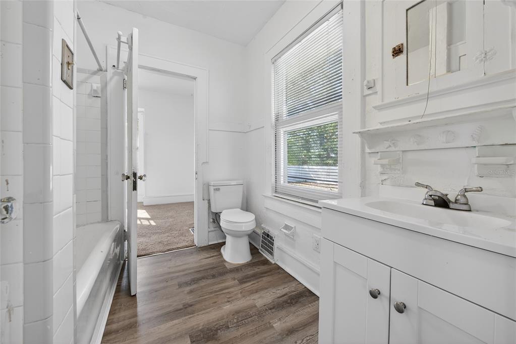 1616 Cres Ridge Road Daytona Beach, FL 32118 - Photo 20 of 40 a bathroom with a sink toilet vanity and shower