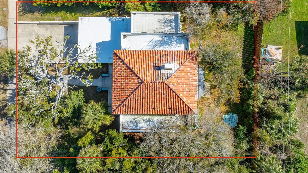 1616 Cres Ridge Road Daytona Beach, FL 32118 - Photo 29 of 40 an aerial view of a house with a yard and garden