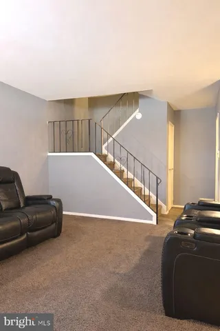 a living room with a bed and a couch