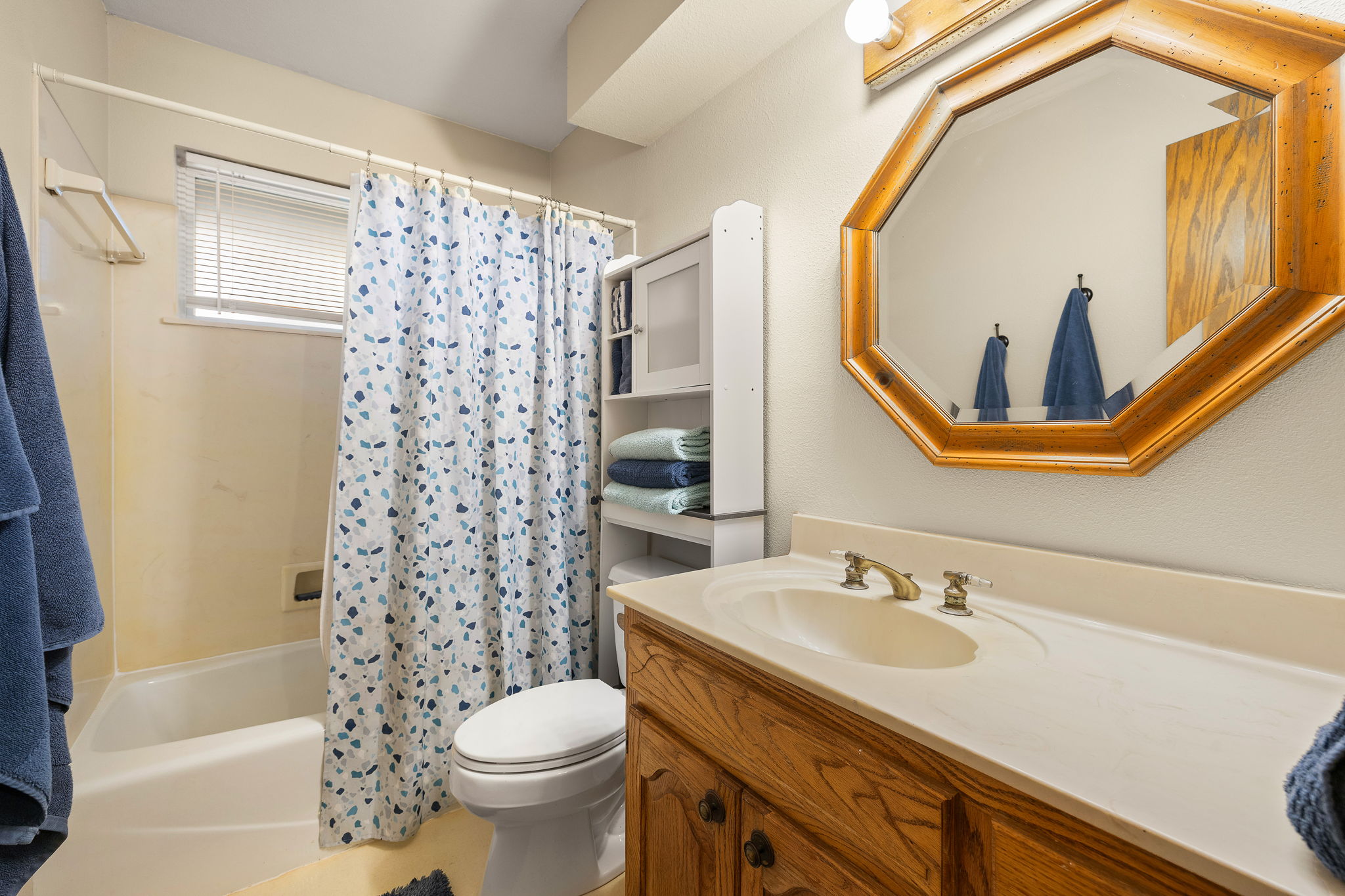 136 Valley View Road Georgetown, TX 78633 - Photo 27 of 40 Cute secondary bathroom is on the wing with the secondary bedrooms and laundry room, on opposite side of the living room from the primary suite.
