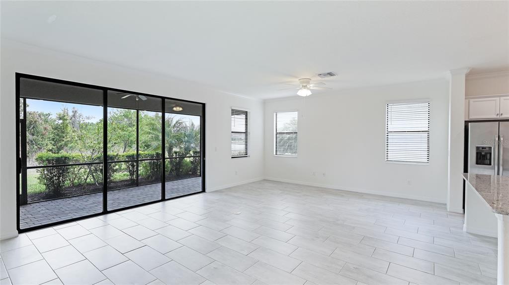 17311 Blue Ridge Place Bradenton, FL 34211 - Photo 11 of 55 wooden floor in an empty room with a window
