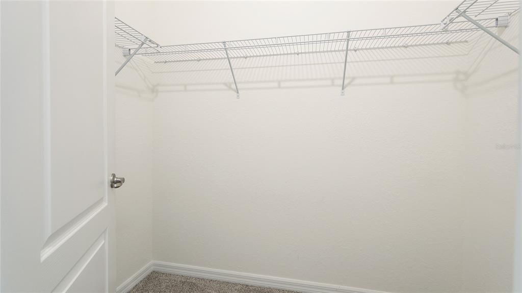 17311 Blue Ridge Place Bradenton, FL 34211 - Photo 17 of 55 a view of a room with racks on the wall