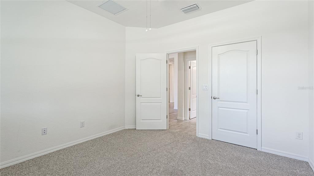17311 Blue Ridge Place Bradenton, FL 34211 - Photo 29 of 55 an empty room with closet area