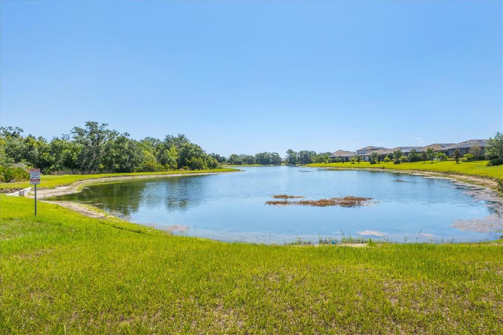17311 Blue Ridge Place Bradenton, FL 34211 - Photo 39 of 55 a view of a lake with houses in the back